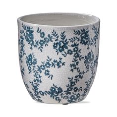 a blue and white vase with flowers on it