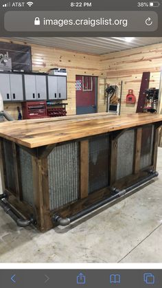 a kitchen island made out of wood and metal