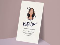 a business card with a woman's face on it and stars around the edges