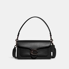 A modern take on an archival 1970s Coach design our structured Tabby shoulder bag is crafted of polished pebble leather. Finished with our Signature hardware for an iconic touch the compact 26 features two detachable straps to carry by hand style as a short shoulder bag or wear crossbody. | Coach Tabby Shoulder Bag 26 - Women's - Pewter/black Coach Bag Black, Coach Black Bag, Coach Tabby Black, Black Designer Bag, Coach Tabby Bag, Coach Tabby 26, Coach Tabby Shoulder Bag, Black Designer Bags, Tabby Shoulder Bag 26