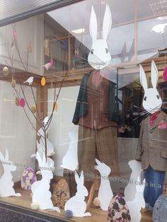 the window display is decorated with paper rabbits