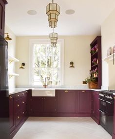 a kitchen with purple cabinets and white counter tops