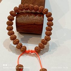 Rudraksha, the most celebrated esoteric accessory of spiritual seekers has been used extensively since time immemorial. This Panchmukhi (Five Faced) Rudraksha Bracelet assists one's spiritual growth. Botanically known as Eliocarpus Ganitrus, Rudraksha are the dried seeds of a tree which grows in select locations of South-East Asia, predominantly in the upper Himalayan mountain. * Rudraksha offered by Harshvi™ is carefully selected and checked for their quality and authenticity. Additionally, the Adjustable Spiritual Bracelets For Festivals, Adjustable Bracelets For Meditation And Festivals, Adjustable Orange Bracelets For Festivals, Adjustable Spiritual Hand-strung Mala, Hand-strung Bracelets For Rituals And Festivals, Beaded Bracelets For Rituals And Festivals, Traditional Adjustable Bracelet With 8mm Beads, Adjustable Hand-strung Spiritual Mala, Traditional Rosary Bracelet For Meditation