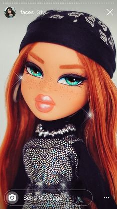 a doll with long red hair wearing a black outfit