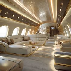 the interior of an airplane with white couches and gold trimmings on the ceiling