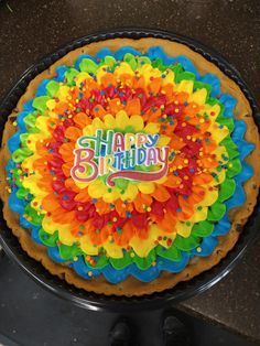 a colorful birthday cake with the words happy birthday on it