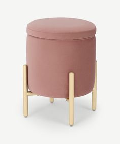 a pink stool with wooden legs and a round footstool in front of a white background