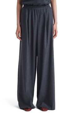 Floor-sweeping cuffs give dramatic sophistication to these office-ready pants cut from a stretchy blend of breathable wool and plush cashmere. 32" inseam; 32" leg opening; 11 1/2" front rise; 15 1/2" back rise (size Medium) Elastic waist 90% wool, 8% cashmere, 2% elastane Side-seam pockets Dry clean Made in the USA Elegant Full Length Cashmere Pants, Cashmere Wide-leg Work Pants, Chic Cashmere Workwear Pants, Chic Cashmere Pants For Work, Elegant Cashmere Wide-leg Pants, Elegant Wide-leg Cashmere Pants, Gray Wide Leg Pants For Formal Fall Occasions, Elegant Gray Wool Bottoms, Elegant Gray Dress Pants For Fall