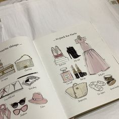 an open book with pictures of women's clothes and purses on the pages