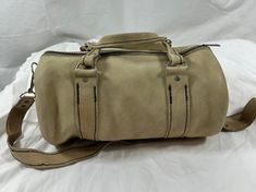 Measurements are 13" wide, 6" high, 6" deep with one 40" shoulder strap side to side with a 19" drop. On the interior there is one main compartment, unlined interior with dark stitching and a top zipper closure. The leather on this purse is thick and strong and is beige/light tan with great detail.  There are some light scuffs with no tears, some water spots and the shoulder strap is detachable. Bag is custom made and is a great vintage find.  -----------------------------------------I SHIP WORL Medium Satchel With Detachable Strap For Travel, Medium Travel Satchel With Detachable Strap, Leather Medium Satchel With Detachable Strap, Medium Leather Satchel With Detachable Strap, Medium Satchel With Adjustable Strap For Travel, Medium Travel Satchel With Adjustable Strap, Leather Crossbody Duffle Bag With Detachable Strap, Medium Leather Bag With Detachable Strap, Medium Leather Satchel