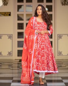 Red has always been the color of the fashion town! A masterpiece in itself, the dabu print and the white border at the hemline just add extra grace to the attire. Kurta - A dabu print cotton 6 meter Flair kali Kurta, white cotton lace on hem & length - 48 inch Pant - A semi-elasticated white cotton pant, length - 37 inch Dupatta - Dabu printed cotton dupatta with lace on all edges Color - Red Material- Cotton, Dabu Hand Print CARE: Dry clean & Quick deep wash only Shipping - 10-12 days. Cotton Anarkali Suits, Dabu Print, Long Gown Design, Cotton Anarkali, Best Summer Dresses, Cotton Dupatta, Kurta Designs Women, Fashionable Outfits, Printed Cotton Dress