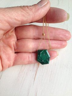 A vibrant and edgy semi raw malachite drop hangs from a 14k gold filled chain. The gold bead in center allows you to adjust your pendant to shorter or longer length.See LAPIS design of this necklace here: https://www.etsy.com/listing/542796254/lapis-necklace-lapis-jewelry-lapis?ref=shop_home_active_1Stone sizes range between 1/2 -1 inch.Length of necklace range from 16 inches- 22 inches.MATERIAL:GOLD-FILLED - 14k Gold filled is considerably durable and considered a lifetime piece of jewelry. Thi Handmade Gold Malachite Necklaces, Handmade Gold Necklaces With Malachite, Handmade Gold Necklace With Malachite, Unique Malachite Necklace Gift, Green Malachite Necklace For Gift, Gold Malachite Necklace As Gift, Malachite Pendant Necklace As Gift, Malachite Gemstone Necklace For Gift, Malachite Pendant Necklace For Gift