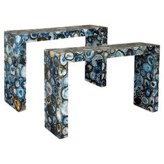 two pieces of art made out of blue and white marbles, one is shaped like a rectangle