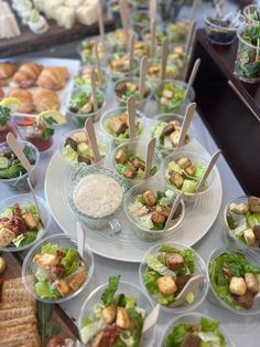 an assortment of salads and appetizers on a table