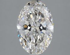 an oval cut diamond on a gray background