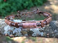 Jasper Tube Beads on a square copper wire bracelet.This bracelet has been oxidized, polished and sealed to prevent tarnishing. Sealed with Protectaclear. ProtectaClear is a clear, protective coating that is tough enough to protect jewelry and is safe for wear against skin. ProtectaClear is practically invisible once applied and will seal and protect jewelry from tarnish, oxidation, and corrosion Adjustable Rectangular Bronze Jewelry, Brown Copper Wire Wrapped Bracelets, Adjustable Copper Bracelets For Healing, Adjustable Rustic Copper Bracelets, Adjustable Rustic Copper Bracelet, Copper Wire Bracelet, Chain Ideas, Altered Jewelry, Accessory Design