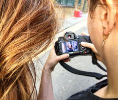 a woman taking a photo with her camera