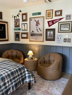 a bed room with a neatly made bed and pictures on the wall