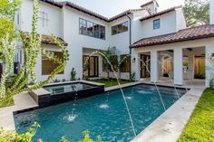 a house with a pool in the front yard