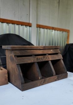 a wooden box sitting on top of a white table