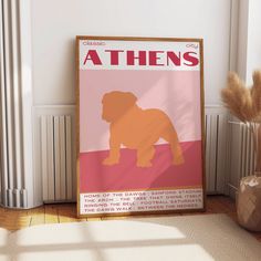 a poster with a dog on it sitting next to a vase and some dried grass