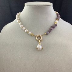 Handmade genuine freshwater pearl, genuine purple quartz nuggets, and genuine 18mm baroque pearl pendant.  This one-of-a-kind hand-beaded necklace is 17 inches in length, asymmetric with half pearls and half quartz, has a lobster clasp in the back, and a large sailor clasp holding the genuine baroque pearl pendant.  This is for the jewelry lover who truly wants that piece that no one else has.  It is beaded on 19 strand beading wire for strength, but has the flexibility of silk thread.  A must h Half Pearl Half Bead Necklace, Forever Necklace, Stone And Strand, Baroque Pearl Pendant, Hand Beaded Necklace, Fresh Water Pearl Necklace, Necklace Amethyst, Purple Quartz, Beads Bracelet Design