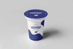 yogurt cup with blue lid on grey background, mockup for packaging design