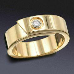 a gold ring with a diamond in the center