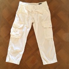 Nwot Mason's Women's Cargo Capri Pant -Color = Solid White -Size = Women's / Italian 42 -Fit = Cargo-Style. Capri Length. Button-Zipper Closure. Rear Flap Pockets With Snap Closure. White Eyelet Detail Around The Interior Waist Band. Side Pockets On Both Legs. Designed & Made In Italy. -Content = 100% Cotton -Condition = Nwot. Measurements (Approx.): -Rise = 9" -Inseam = 23" Cotton Cargo Capri Bottoms, Cotton Capri Bottoms With Cargo Pockets, Cotton Bottoms With Cargo Pockets In Capri Length, Cotton Capri Pants With Cargo Pockets, Mid-rise White Cargo Pants, White Mid-rise Cargo Pants, Capri Length Cotton Cargo Pants With Side Pockets, Cotton Cargo Capri Pants With Pockets, Cotton Capri Length Cargo Pants With Pockets