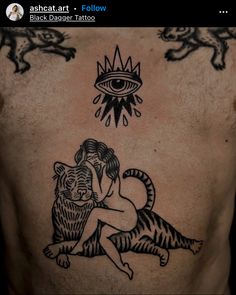 an image of a man with tattoos on his back that has a tiger and eye