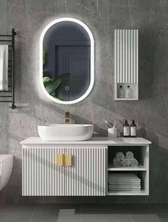 a bathroom with a sink, mirror and towel rack on the wall next to it