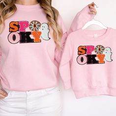 Get your Fall on with these Matching Mommy and Me Spooky Chenille Patch Sweatshirts! These are so darn cute! Plus these Chenille Patches are all the rage. A Great Halloween Sweatshirt You both will love! Also perfect for all season long. Super Soft and Comfy for snuggling and think of all the great pics! Plus great for trick or treating too! >Click on the drop down menu for size options Please know the child pink is slightly different than the adult pink but both a light pink.  Thank you! You ar Family Matching Pink Tops For Fall, Playful Crew Neck Tops For Halloween, Chenille Patch Sweatshirt, Halloween Crewneck Sweatshirt, Chenille Patches, Patch Sweatshirt, Chenille Patch, Halloween Crewneck, Sweatshirt Halloween