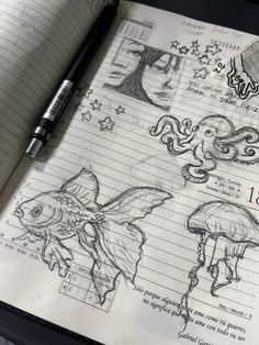 an open notebook with some drawings on it