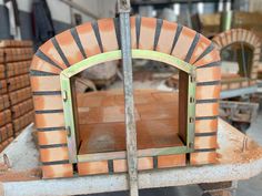 a brick oven sitting on top of a table