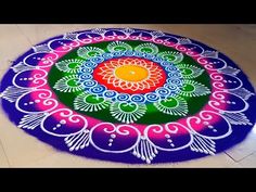 a colorful rangdi design on the floor