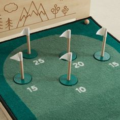 • Our Keen Putting Green is the perfect way to practice putting and have a great view of the mountains and sunshine! • The set includes 5 flags on wooden bases to fit into holes with printed scores, an adjustable height golf club, and 3 wooden balls. • Kids of all ages can practice aiming for the hole or make a game out of it to try to get the highest score. • With a bit of an upward slant, this putting green is sure to bring a fun and challenging experience for your little one. • Start from any Golf Bedrooms For Boys, Vintage Golf Nursery, Golf Nursery Baby Boy, Golf Themed Nursery, Golf Nursery, Golf Cookies, Indoor Golf, Golf Birthday Party, Golf Theme