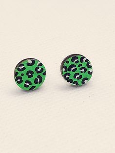 Hand painted leopard print stud earrings. These cute coloured leopard print earrings have been hand painted in acrylic paint and then varnished to seal the image. A fun statement pair of earrings in funky green. Being hand painted each pair is totally unique to you! Comprised of- Silver plated stud backs and butterflies. Hand painted and varnished leopard print wooden charms (10mm) As these earrings are hand painted they will vary slightly from the images shown. They are sealed with varnish but i still recommend not showering/ swimming in them. All of our Jewellery comes on a Laura Loves Jewellery presentation card and is presented in dainty glassine bags. A hand written gift note can be written on request and the gift can be posted directly to the recipient if wisheda perfect letter box g Leopard Print Earrings For Gift, Leopard Print Earrings For Pierced Ears As Gift, Trendy Leopard Print Earrings As Gift, Trendy Hand Painted Green Earrings, Adjustable Leopard Print Earrings For Gift, Trendy Green Hand-painted Earrings, Trendy Green Hand Painted Earrings, Painted Leopard Print, Leopard Earrings