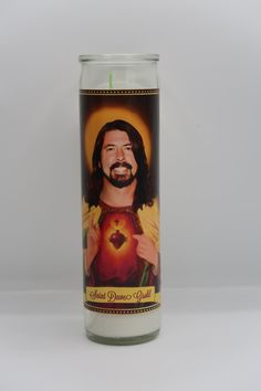 a candle that has a picture of jesus on it