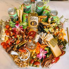 a tray filled with lots of different types of food and drinks on top of a table