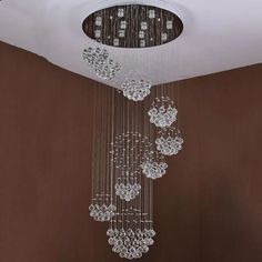 "Discover the epitome of modern lighting with our new LED Chandelier and Crystal Staircase Pendant Light collection. Elevate your space with these sleek, hotel-inspired fixtures designed for large villas. Illuminate your home in style!" Staircase Pendant Lighting, Cheap Lamps, Chandelier Lighting Modern, Ball Chandelier, Modern Room Decor