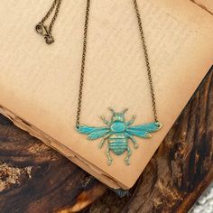 "Oxidized silver plated bee pendant made from vintage tooling. Hung from 16 inches of antiqued silver chain finished with a lobster claw clasp. The bee measures 2 1/4\" by about 1 1/4\". I also have this piece in antiqued brass and patina. I can make the length of any necklace longer or shorter by request :) Each purchase comes in a gift box." Vintage Hand-cast Bronze Necklaces, Vintage Hand Cast Bronze Necklaces, Vintage Bronze Hand-cast Necklaces, Vintage Bronze Hand Cast Necklaces, Vintage Metal Necklace With Patina, Vintage Bronze Pewter Jewelry, Vintage Patina Metal Necklace, Vintage Pewter Pendant Necklace, Adjustable Brass Necklace With Patina