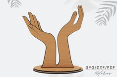 two hands holding each other on top of a wooden stand