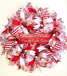 a red and white christmas wreath that says, christmas wishes can't be missed