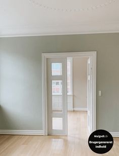 an empty living room with hard wood flooring and white trim on the walls is shown