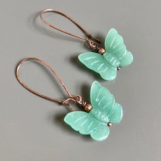 "Aventurine Butterfly Earrings - Carved Aventurine Butterflies with Antiqued Copper Beads on long Antiqued Copper Earwires Earrings are lightweight for easy wearing The Butterflies are just under 1\" wide x .75\" high The earrings measure 2\" from top of earwires to bottom  Antiqued Copper Earwires" Aventurine Drop Earrings For Gift, Aventurine Natural Stone Earrings Gift, Aventurine Natural Stone Earrings, Aventurine Dangle Earrings For Gift, Aqua Earrings, Woman Birthday, Gift For Woman, Gift Graduation, Natural Gifts