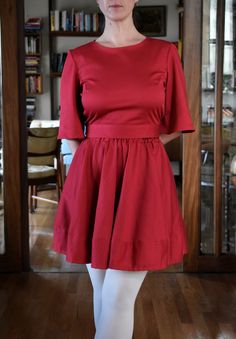 This is a 100% cotton full skirt with elaticated waist in red. The skirt is made out of a beautiful high quality cotton sateen - this fabric has a suble sheen giving it a luxurious look. The fabric is thick, soft and has a little bit of stretch to it making it very comfortable to wear. This is a versatile garment as the skirt can be easily dressed up with a top or worn with a jumper for a more casual look. The lenght of the skirt is approximately 44cm (17''). Shown here with the red cotton sateen full circle skirt.  This item here is in size S and the model's height is 165cm (5′4″).  If you would the to lenghten or shorten the hem please let me know - it is easy to do to! Available sizes (see size chart in photos): XXS, XS, S, M, L, XL, XXL.  Current production time is up to 2 weeks. Red Flared Cotton Skirt, Red Cotton Flared Skirt, Red Pleated Dress With Relaxed Skirt, Red Dresses With Pleated Relaxed Skirt, Red Dress With Relaxed Flared Skirt, Red Flared Dress With Relaxed Skirt, Red Fitted Skirt With Elastic Waistband, Stretch Red Skirt With Elastic Waistband, Cotton Lined Mini Skirt Dress