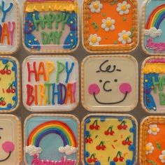 there are many decorated birthday cakes on the trays that have happy birthday written on them