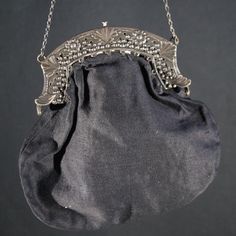 A Victorian ladies handbag with a silver clasp.  Fine example of a lady's handbag worn to church at the end of the 19th century. The clasp is marked wit a tiny Lion silver mark. Antique. Size  W 14 H 15 cm. It has been around for more then a century but just a tiny bit of wear. Still beautiful and surely wearable at your next royal funeral. Please have a look at all our vintage handbags in the  - Ladies Handbags - or the - Ladies first -  section in the Wünderkammer shop here on Etsy. Brocante, Luxury Victorian Silver Bags, Classic Silver Shoulder Bag For Formal Events, Classic Silver Shoulder Bag For Formal Occasions, Vintage Rectangular Shoulder Bag With Silver-tone Hardware, Vintage Coin Purse For Wedding, Victorian Style Rectangular Evening Bag, Vintage Silver Handheld Bag, Antique Style Evening Bag For Weddings, Classic Silver Shoulder Bag For Evening