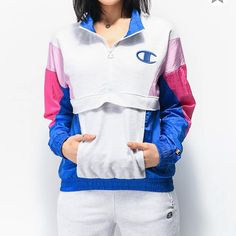 -Brand New With Tags Attached -Mixed Construction With Grey Sweatshirt-Style Chest And Multi-Colored Windbreaker Panels In Pink And Blue Throughout -Features Elastic Sleeve Cuffs And Bottom Hem, Kangaroo Pouch Pocket, Quarter Zip-Up Closure With Mock Neck, And Champion Logo At The Left Chest -83% Cotton, 17% Polyester Casual Pink Half-zip Outerwear, Sporty Pink Track Jacket With Pockets, Casual Pink Cotton Track Jacket, Pink Track Jacket With Pockets For Streetwear, Sporty Pink Sweatshirt With Pockets, Sporty Pink Tops With Pockets, Sporty Pink Top With Pockets, Pink Cotton Athleisure Outerwear, Casual Pink Track Jacket With Pockets