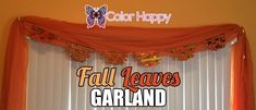 an orange curtain is hanging over a window with the words fall leaves garland on it